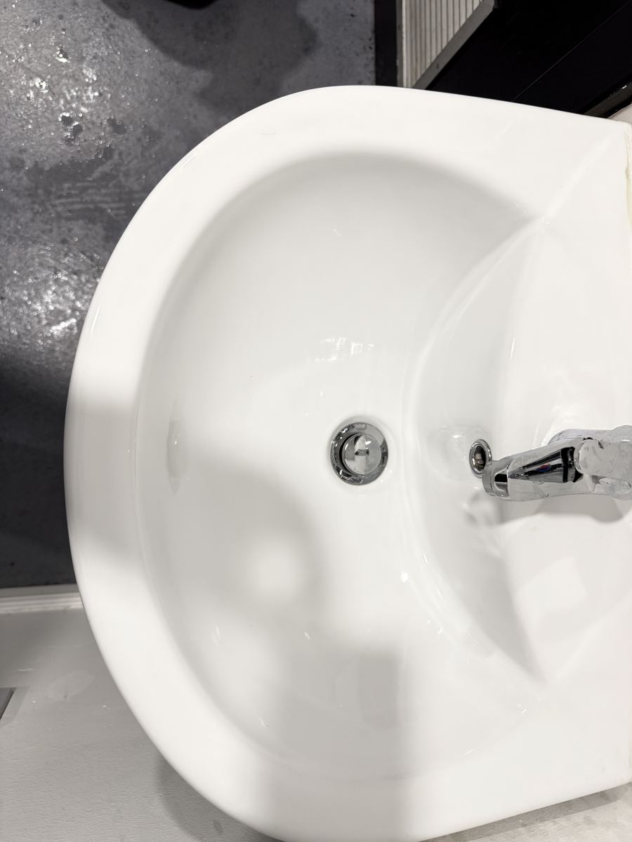 The same bathroom sink after professional cleaning by Cadence Clean