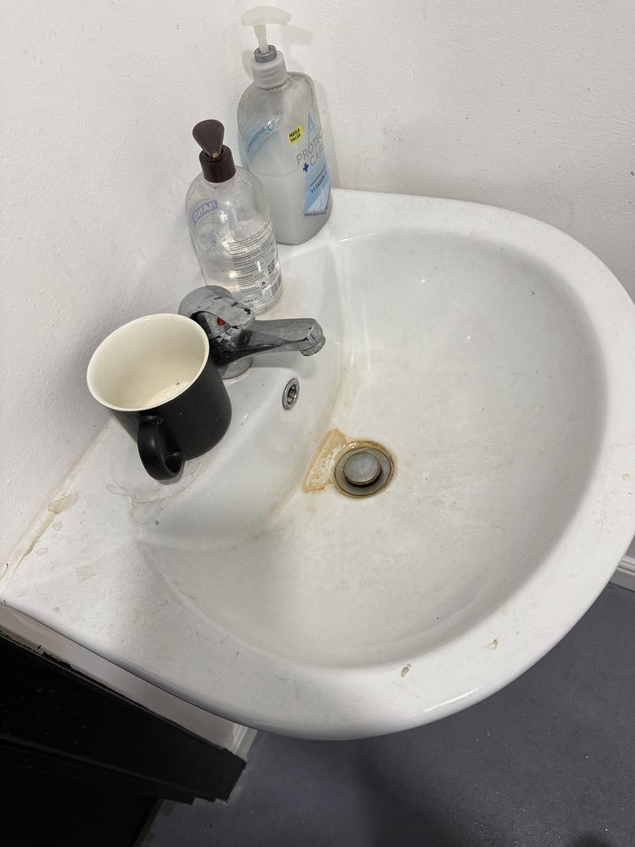 A bathroom sink before cleaning by Cadence Clean in Derby