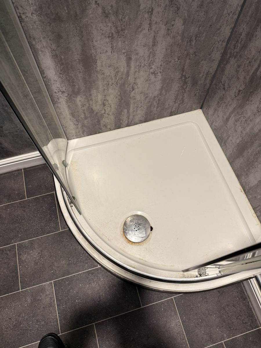 A shower tray before cleaning by Cadence Clean in Derby