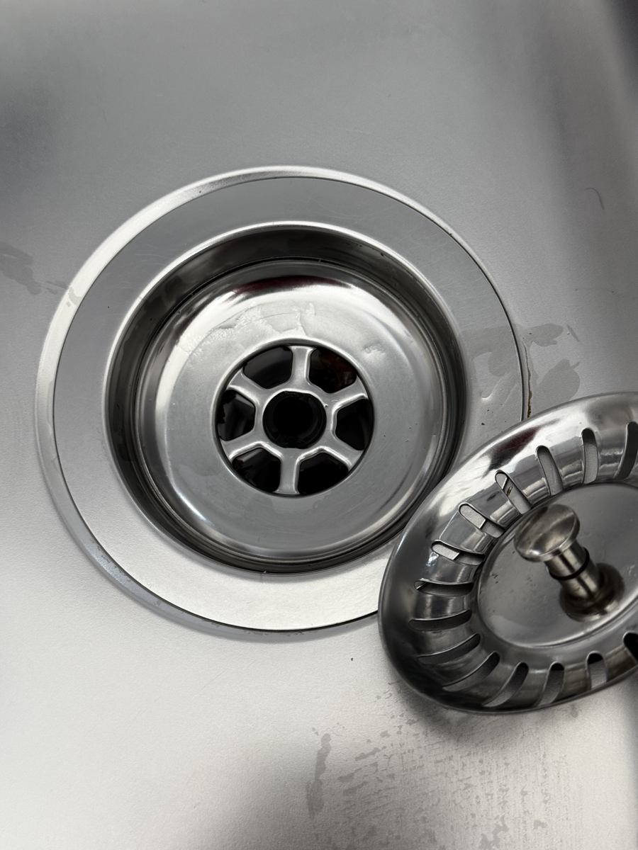 The same kitchen sink drain after professional cleaning by Cadence Clean