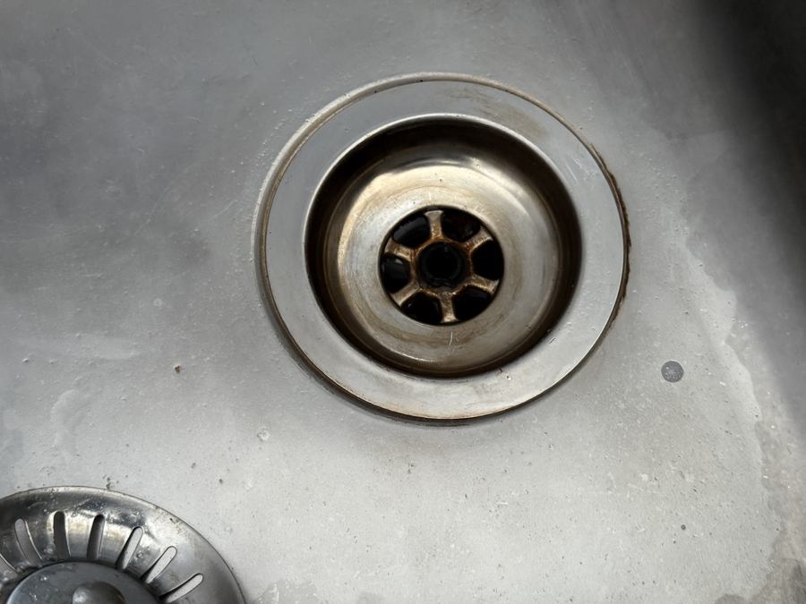 A kitchen sink drain before cleaning by Cadence Clean in Derby