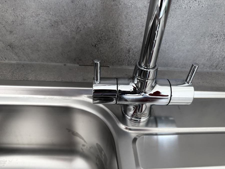 The same chrome tap after professional cleaning by Cadence Clean